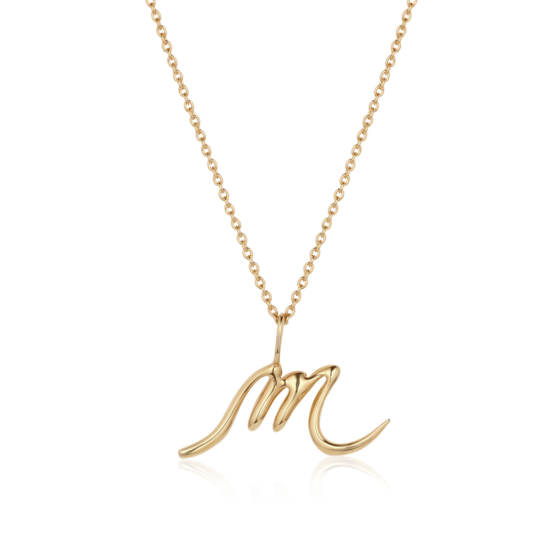 Cursive initial M pendant in 14k gold.