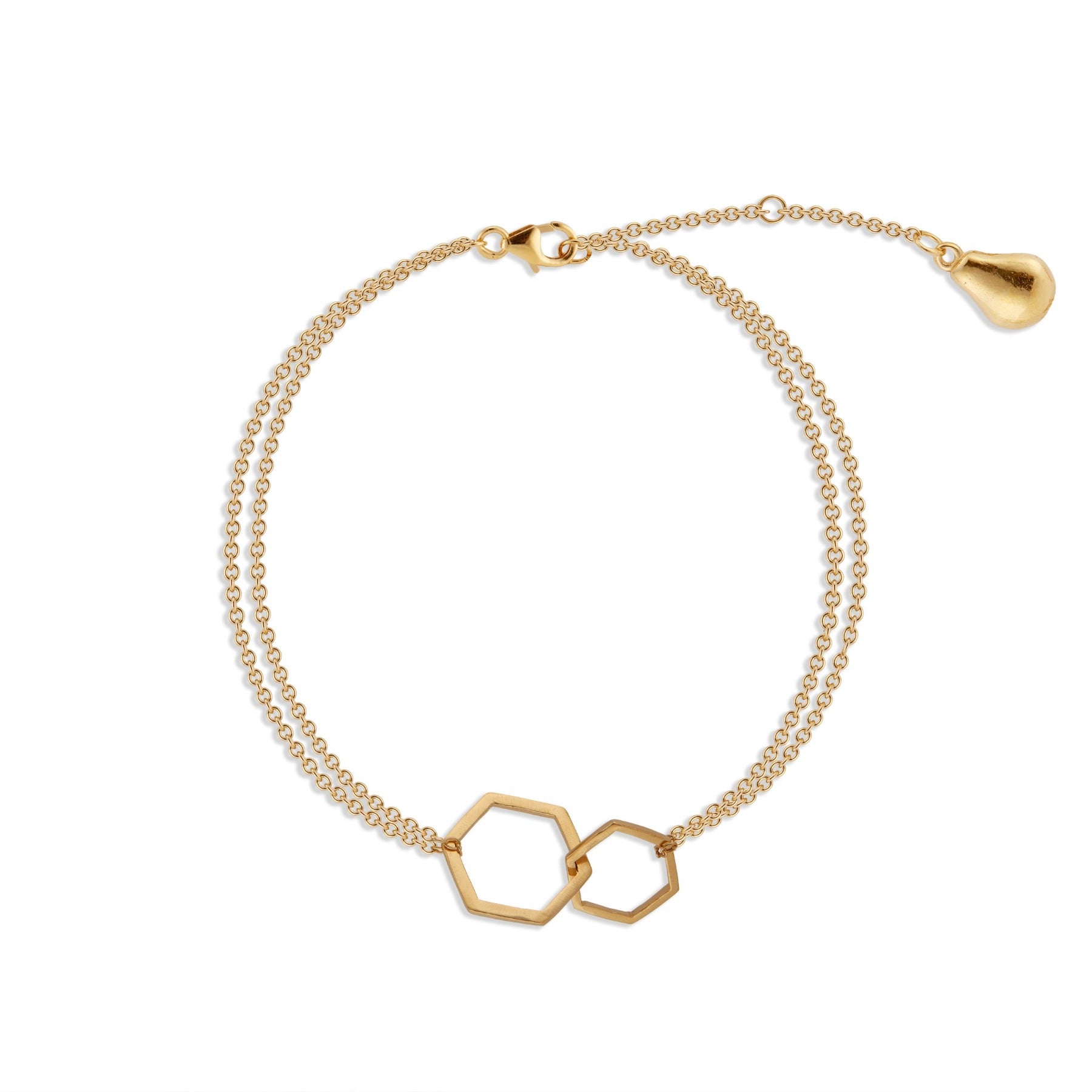 Distressed interlocking geometric hexagons with delicate chain bracelet with gold pear charm in 18k gold vermeil.