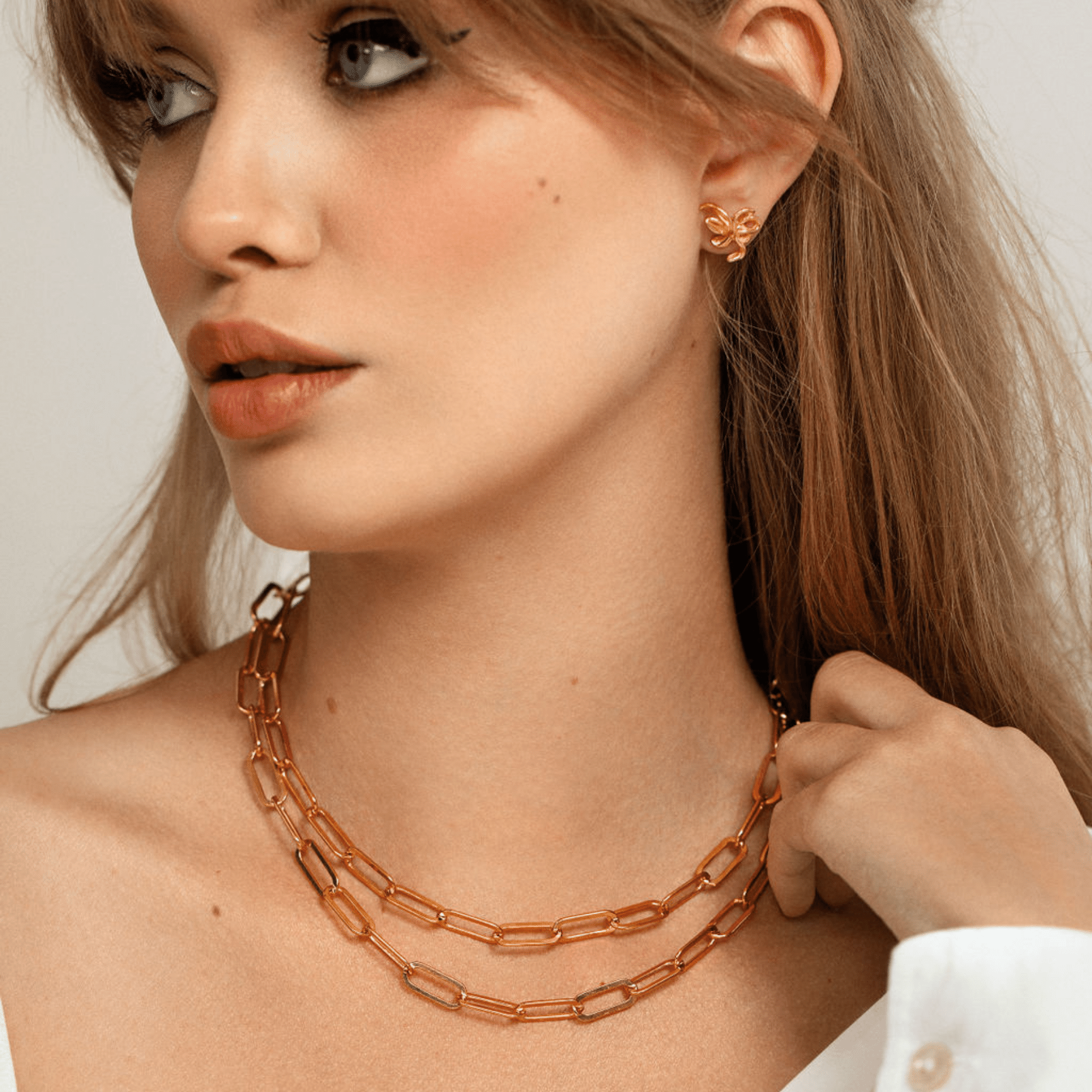 Double layered paperclip chain necklace with toggle clasp in 18k gold vermeil.