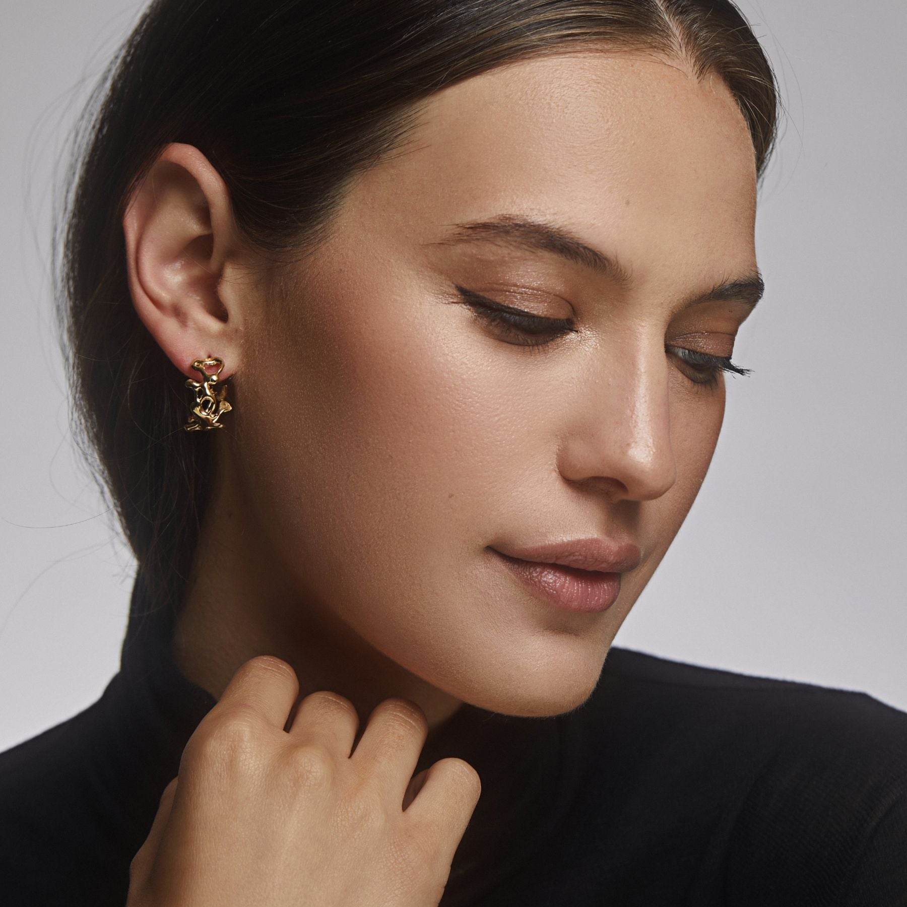 Small abstract, squiggle asymmetrical hoop earrings in 18k gold vermeil.