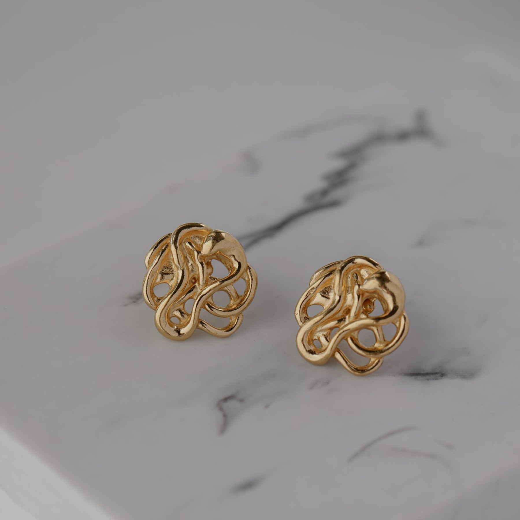 Abstract, squiggle dahlia flower stud earrings in 18k gold vermeil.