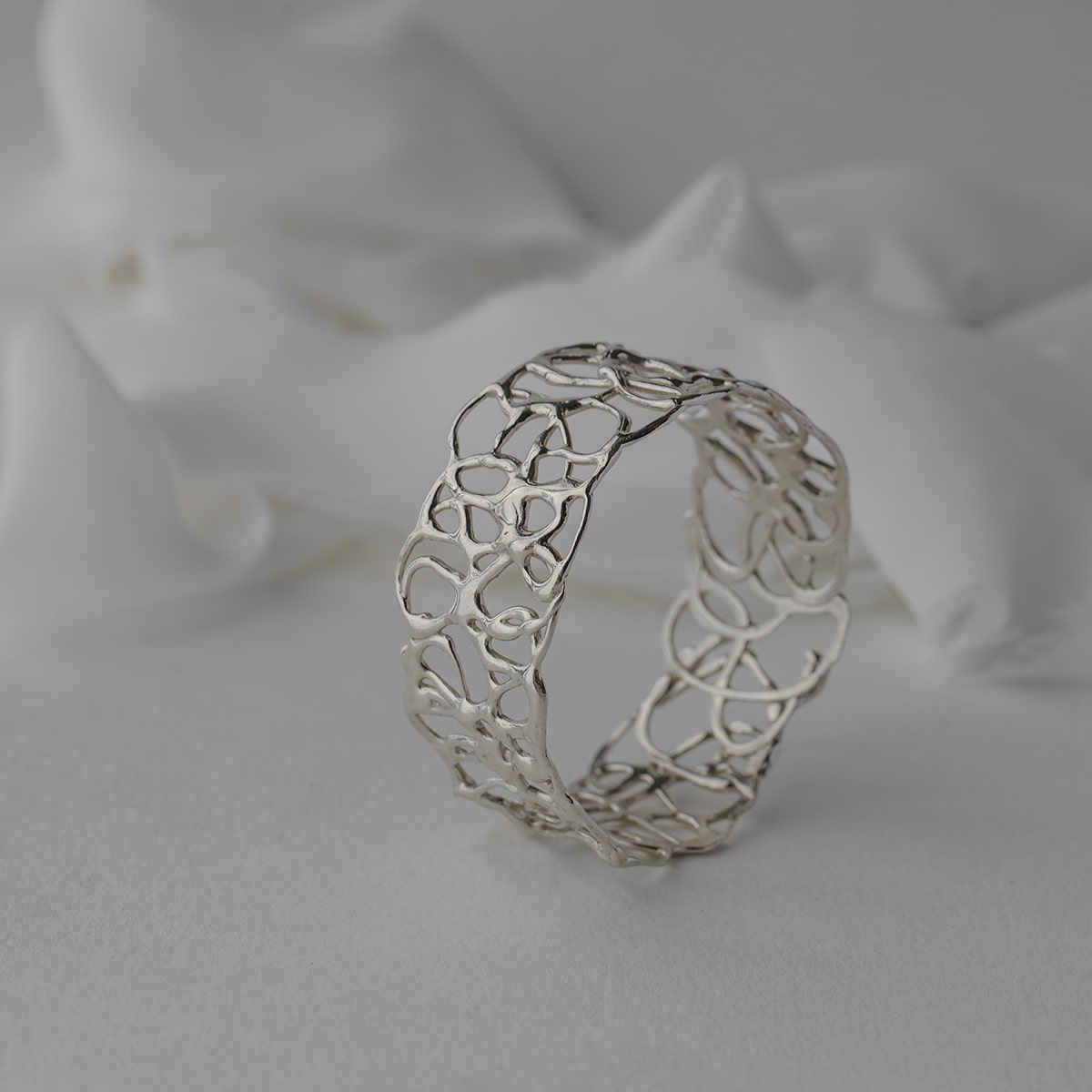 Abstract, squiggle slip on bangle in sterling silver.