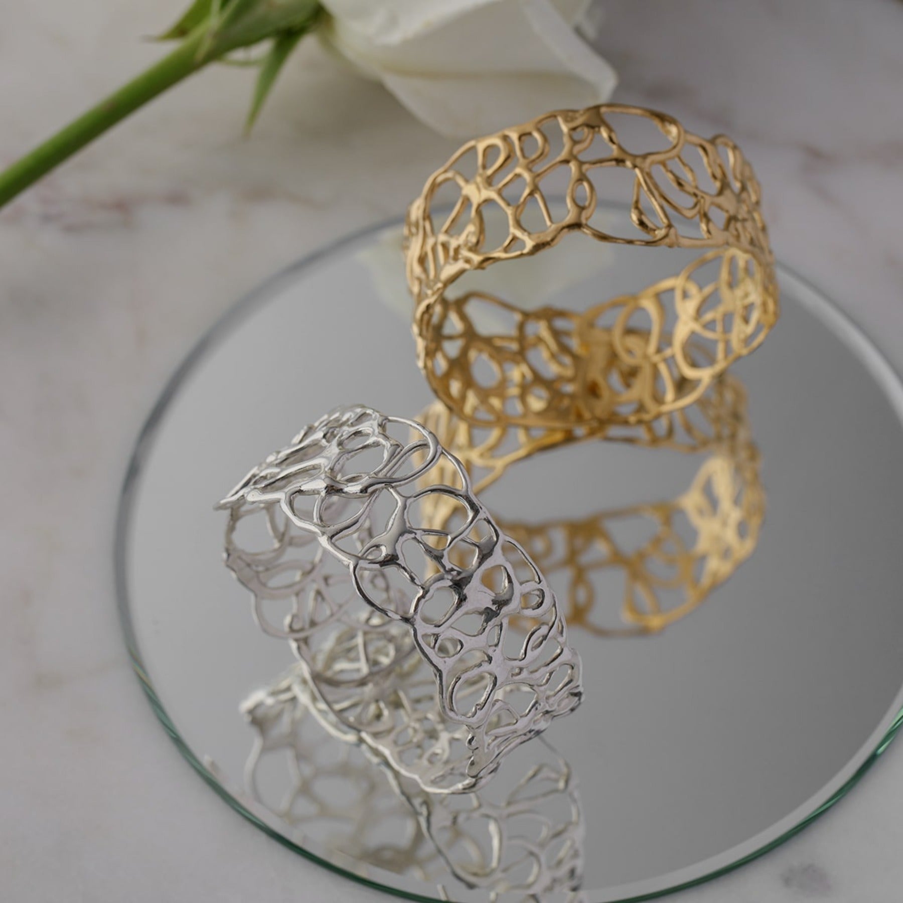 Abstract, squiggle slip on bangles in 18k gold vermeil and sterling silver.