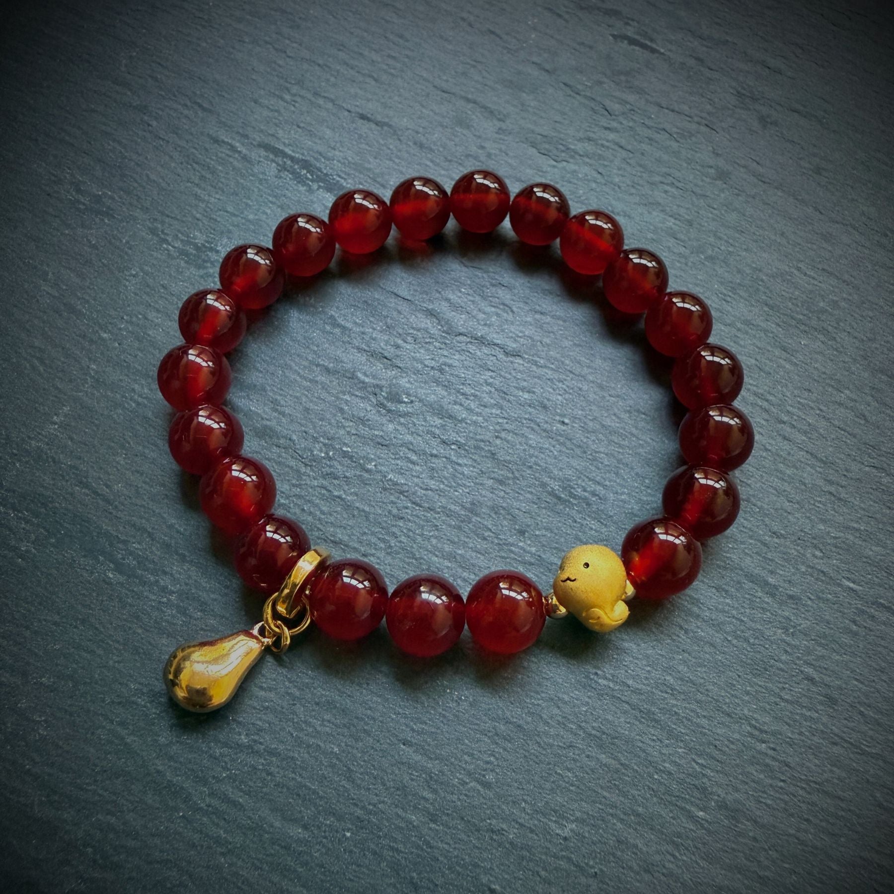 red jade beads with gold plated snake bead