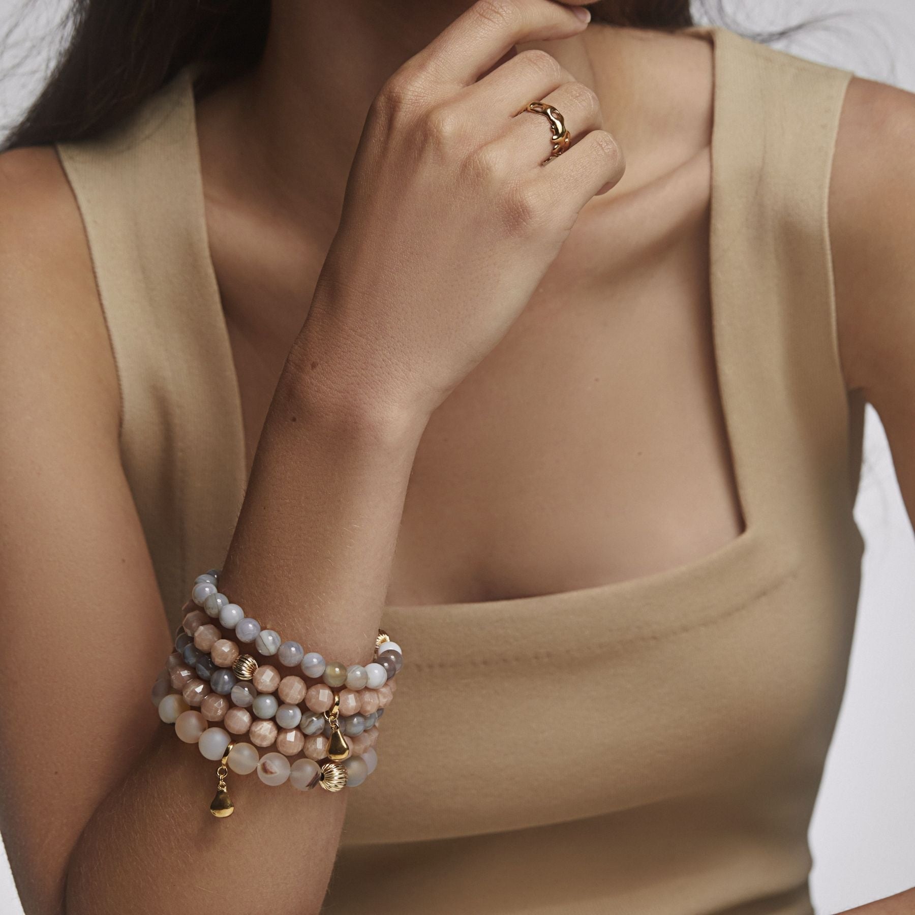 Crystal gemstone elastic bracelets with textured 14k gold-filled accent bead and 14k gold vermeil Anjou pear charm.