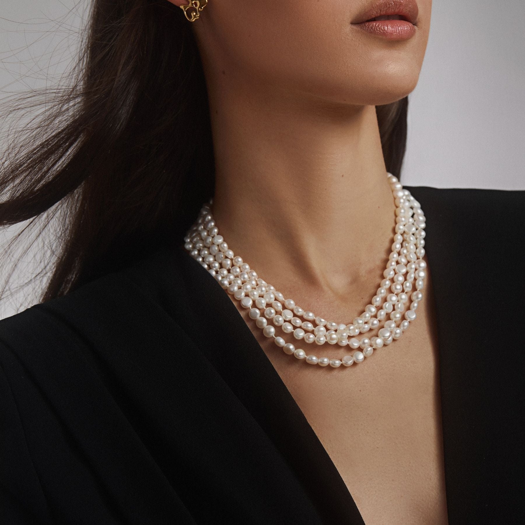 Double strand freshwater cultured button pearl necklace in an opera length finished with a 14k gold-filled toggle clasp, doubled up for a shorter, layered look.