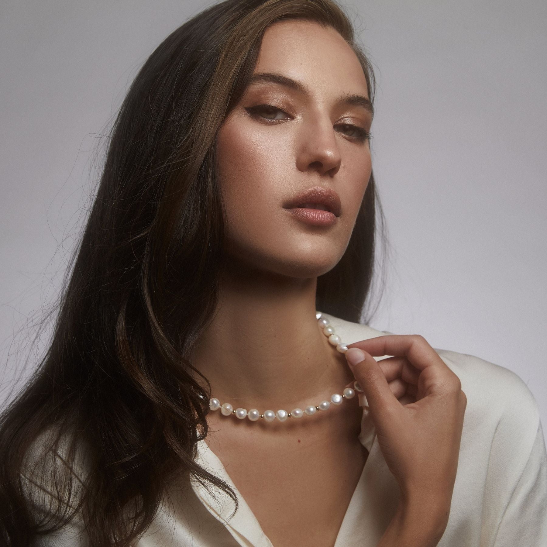 Freshwater cultured button pearl necklace with 14k gold-filled beads interspersed and finished with a 14k gold-filled toggle clasp.