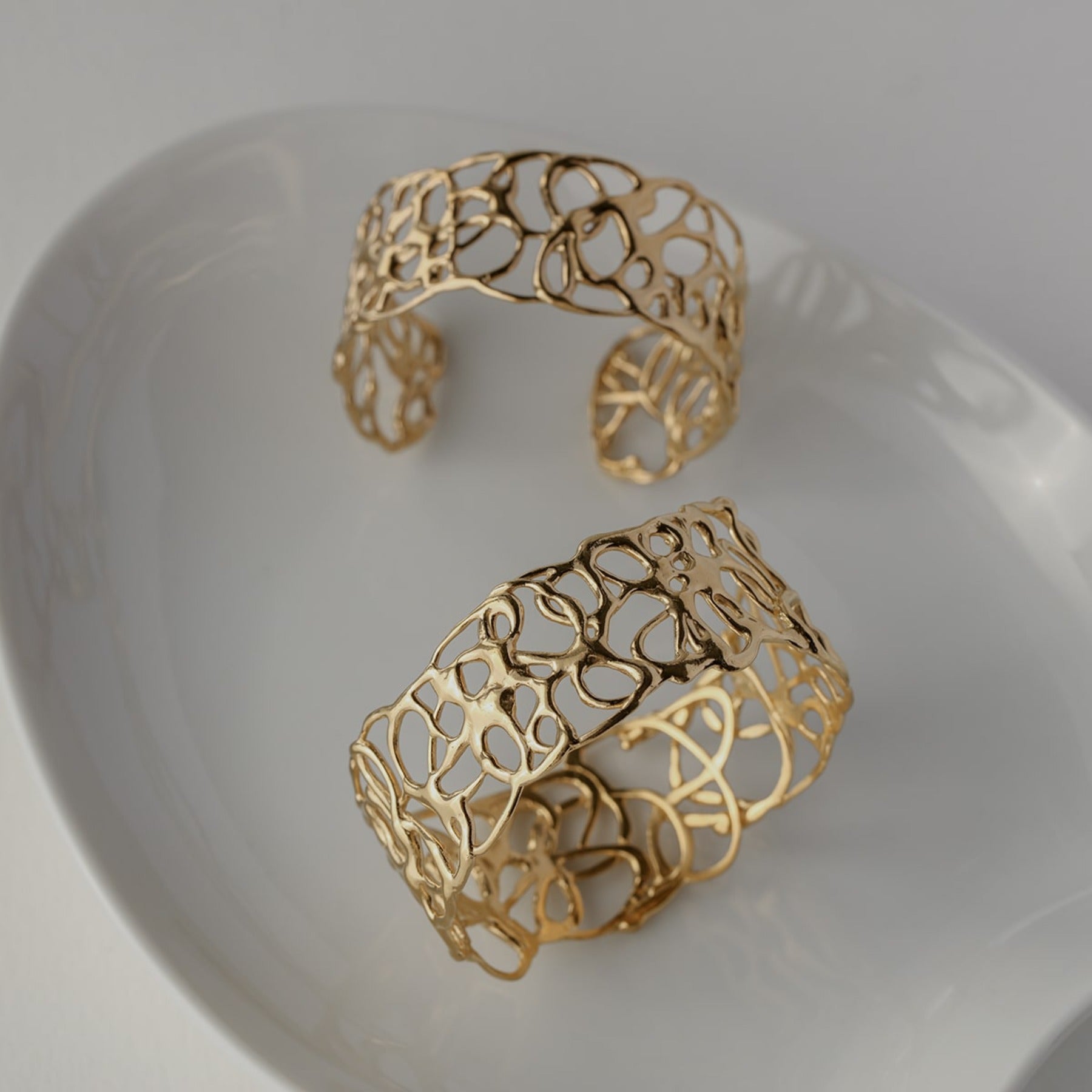 Abstract squiggle wide cuff bracelet in 18k gold vermeil.
